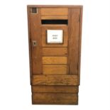 An oak post box, early 20th century. (Dimensions: Height 88cm, width 43cm.)(Height 88cm, width