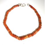 A coral necklace with graduated chunky cylindrical beads and craft silver 'S' hook clasp. (Qty: 1)