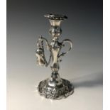 An early Victorian engraved silver taper stick with detachable drip tray and original snuffer in the