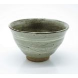 A Leach studio pottery bowl with celadon glaze, impressed mark. (Dimensions: Height 8.5cm.)(Height