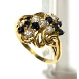 A contemporary 18ct diamond and sapphire ring.