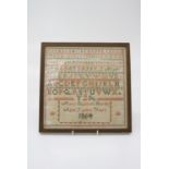 A 19th century needlework alphabet sampler, worked by Mary Elizabeth Hornby aged 12, dated 1864. (