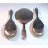 A pair of hammered silver hair brushes and a matching hand mirror. (Qty: 3)