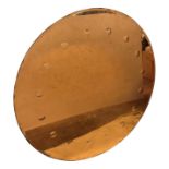A large circular Art Deco wall mirror, with copper tint, within a metal frame. (Dimensions: Diameter