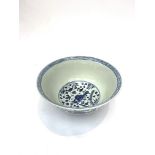 A large Chinese blue and white porcelain punch bowl, 20th century, decorated with fish swimming