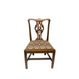 A George III mahogany dining chair, with a pierced vase shaped splat above a drop in seat on