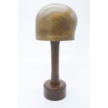 An early 20th century miliner's hat block, on turned stand with circular foot. (Dimensions: Height