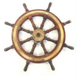 A brass mounted hardwood ship's wheel, late 19th century, with eight turned square section