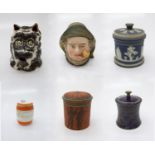 Six pottery tobacco jars, including one in the form of a dog. (Dimensions: Tallest 18cm.)(Tallest