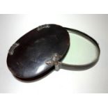 A good large George III tortoiseshell and silver oval magnifying glass. 8cm