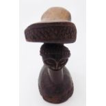 An African carved wood tribal headrest. (Dimensions: Height 20cm.)(Height 20cm.)