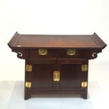 A Chinese hardwood cabinet, with two freize drawers above two cupboard doors on stile feet. (