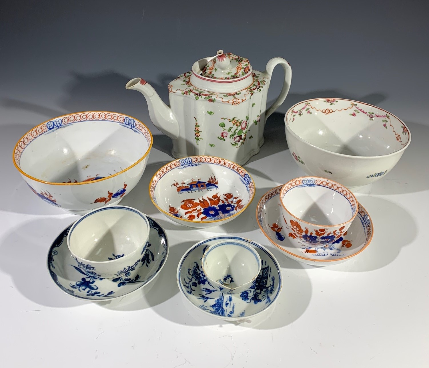 A late 19th century Newhall teapot and slop bowl, both in the 'Knitting' pattern, painted numerals