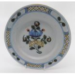 A Liverpool Fazakerley delft tin glazed plate, circa 1760-1770, with central floral decoration and