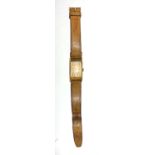 A Waltham wristwatch with brown leather strap.