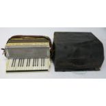 A Mazzini piano accordion with case.