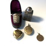Two lockets, gold charm, single ear stud of white stone, scent bottle, boxed thimble