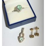A tourmaline and diamond ring in 9 ct gold, a matching pendant and a pair of zultanite earrings.