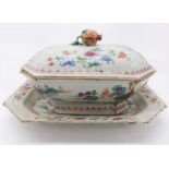 A Chinese famille rose tureen and stand, 18th century. (Dimensions: Height 21cm, width 39cm.)(Height