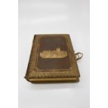 A late 19th/early 20th century leather-bound musical photograph album, the pages illustrated with