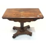 A rosewood card table, early 19th century, the fold over top on a circular tapering stem and