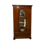 An Edwardian inlaid mahogany wardrobe, with a single mirrored door. (Dimensions: Height 205cm, width