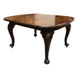 A Victorian mahogany extending dining table, the rectangular moulded top with rounded corners, on