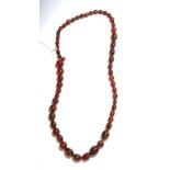 A cherry amber graduated bead necklace, length 80cm.