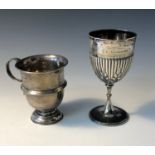 A fluted silver goblet together with a footed silver mug, 7.8oz.