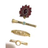 Two gold brooches, a propelling pencil and a garnet set earring.