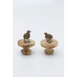 Two early 20th century cold painted bronze grouse sculptures with associated bases.