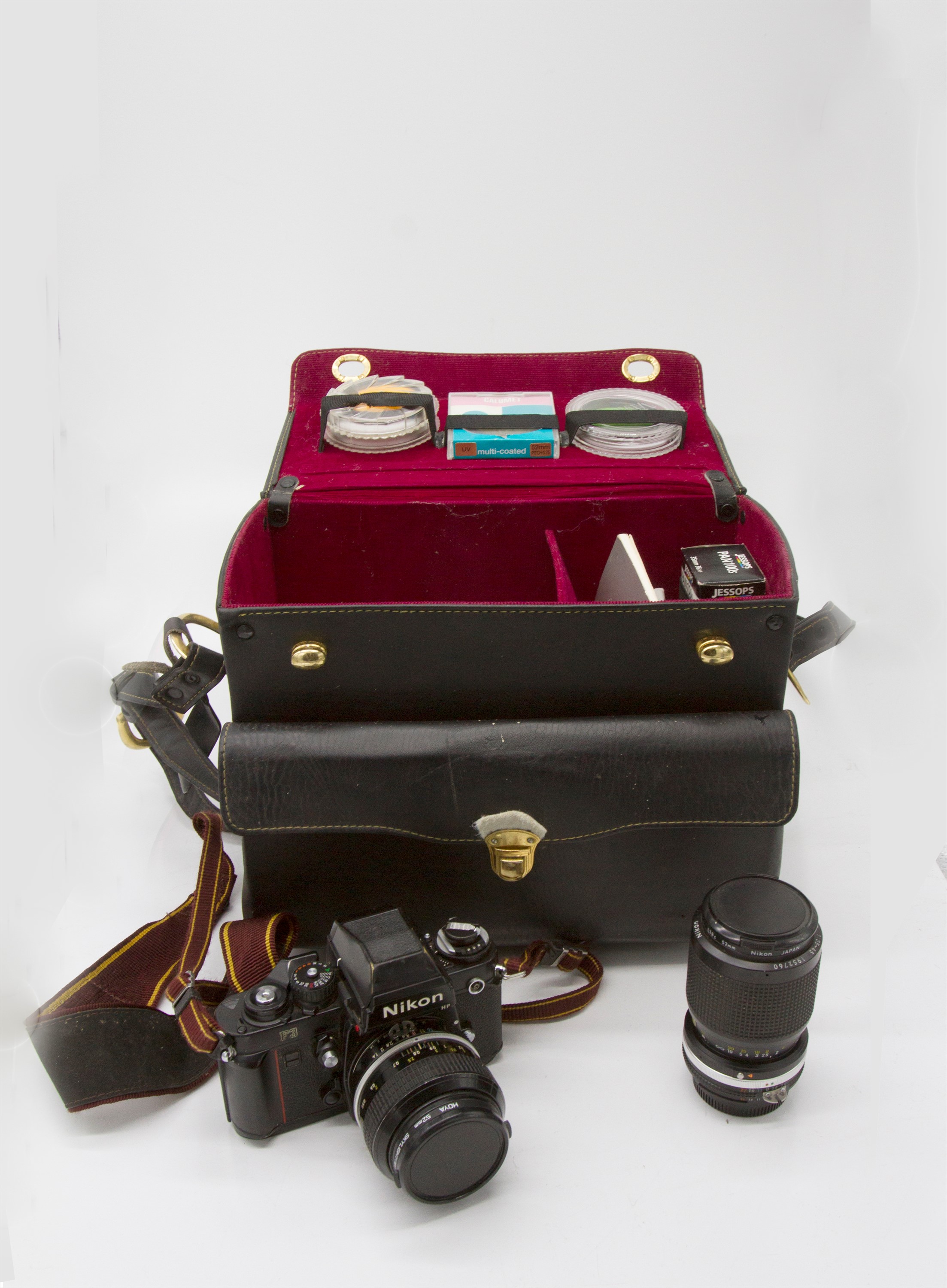 A Nikon F3 SLR camera, with two lenses, various filters, documentation and carrying case.