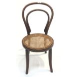 A bentwood child's chair, with a rattan seat.