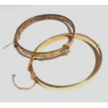 Two hinged 9ct gold bangles, 15.5gm.