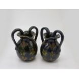 A pair of 20th century twin handled vases with incised flower head decoration. (Dimensions: Height