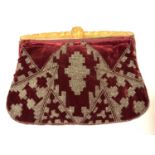 Fine evening clutch purse of plum velvet with carved amber lucite band to the frame and clasp. Steel