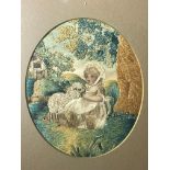 A Georgian oval silk embroidered picture of a girl with a lamb. (Dimensions: Height 15cm.)(Height