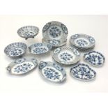 A collection of Meissen 'Onion' pattern porcelain to include twelve plates with pierced borders,