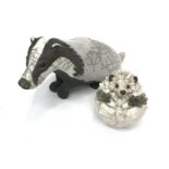 A Brian Andrew raku pottery badger and hedghog, together with a Norby pottery bowl decorated with