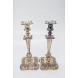 A pair of silver plated candlesticks, Reg. No. 630051, of traditional shape with tapered stems and