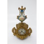 A French gilt spelter mantel clock, with Paris porcelain urn finial and similar painted dial and