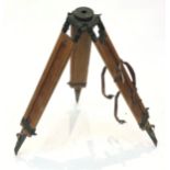 A wooden and metal tripod, with leather carrying strap. (Dimensions: Overall height when folded
