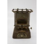 An early 20th century Rippingilles 'Sunrise' cast iron paraffin stove. (Dimensions: Height 28cm.)(