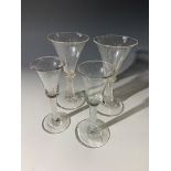 A pair of spiral stem glasses and two 18th century glasses with air twist stems (4). NB one glass