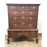 A George III oak chest on stand, with three short and three long drawers, the stand with three