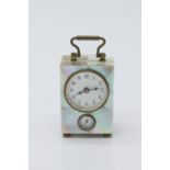 A Miniature German boudoir alarm timepiece, with mother of pearl clad decoration, circular dial
