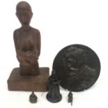 A bronze figure of a monk, hinged at the midriff, height 13cm, together with a circular bronze