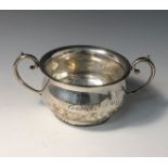 A bellied silver twin handled bowl