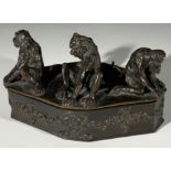 A bronze box of canted form surmounted by three monkeys, with cast signature 'Fratin'. (