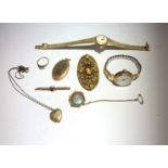 A 9ct ring, a gold cased ladies watch, gold locket etc.